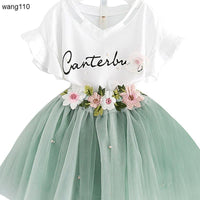 White V-neck kids dress with floral embroidery and mint tulle skirt, perfect for parties or casual wear