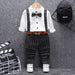 Boys formal outfit with striped suspenders, bow tie, and white shirt for special occasions
