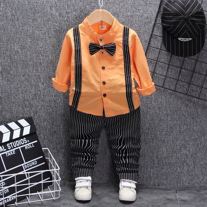 Orange kids shirt with black suspenders, striped pants, bow tie & white sneakers — stylish toddler outfit