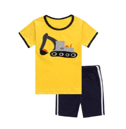 Young boy wearing a summer suit from Ancient Energy, children’s clothing and boys' summer clothes, casual outfit for warm weather.