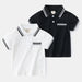Boy wearing a summer polo shirt by Ancient Energy, featuring a classic design and comfortable fit for warm weather.