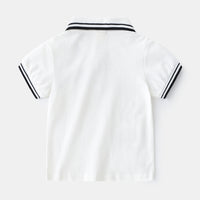 Boy wearing a summer polo shirt by Ancient Energy, featuring a casual t-shirt style perfect for warm weather.