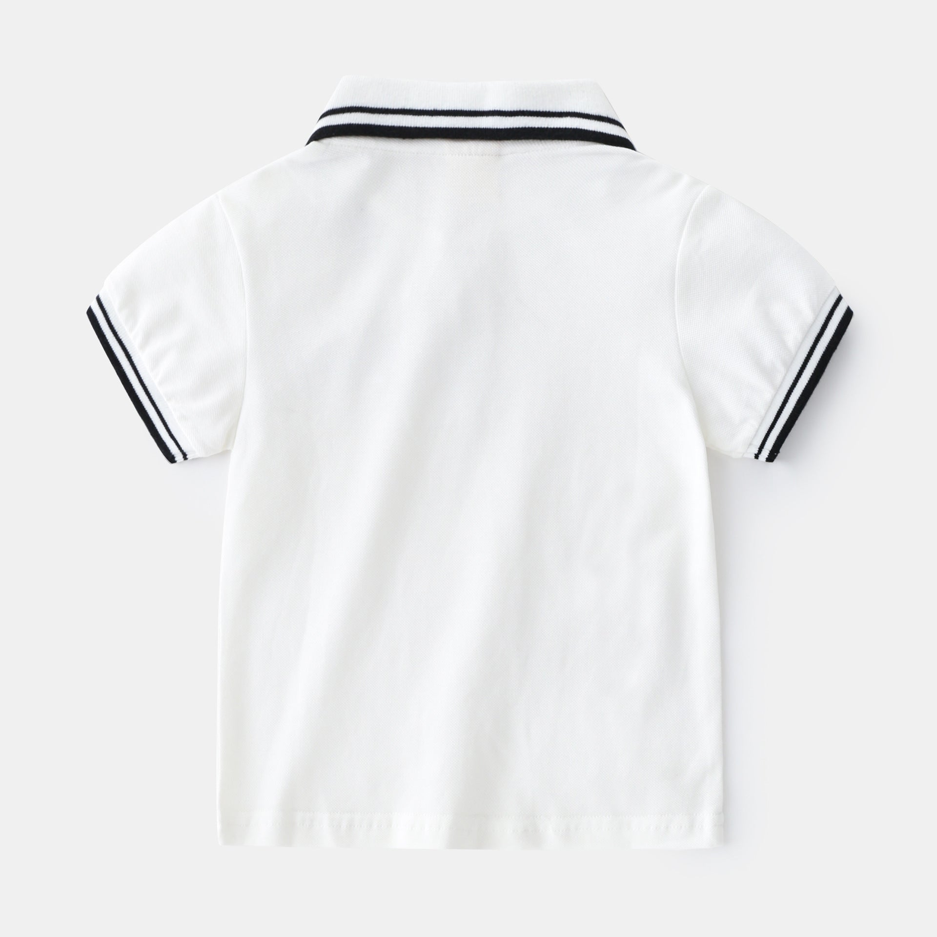 Boy wearing a summer polo shirt by Ancient Energy, featuring a casual t-shirt style perfect for warm weather.
