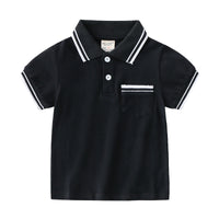 Young boy wearing a blue summer polo t-shirt by Ancient Energy, casual style perfect for warm weather.
