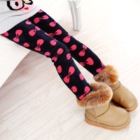 Girls' warm leggings by Ancient Energy, soft and cozy for winter, shown in a vibrant pink color with elastic waistband.