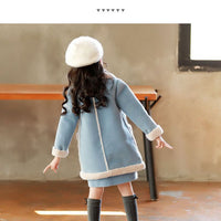 Winter children's clothing by Ancient Energy, featuring a cozy, warm outfit suitable for cold weather conditions.