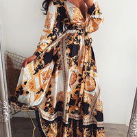 Mandotos International vintage floral evening dress with V-neck, featuring elegant floral pattern and flowing fabric.
