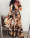 Mandotos International vintage floral evening dress with V-neck, featuring elegant floral pattern and flowing fabric.