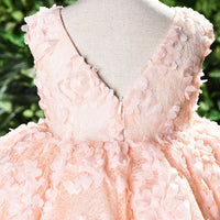 Baby girl dress for one-year-old, light pink with floral patterns, made by Ancient Energy, perfect for special occasions.