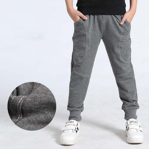 Boy's sports trousers by Ancient Energy, featuring athletic fit, breathable fabric, and sporty design for active wear.