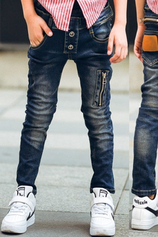 Boy wearing ancient energy stretch denim pants, casual kids' jeans with a comfortable fit and classic blue wash.