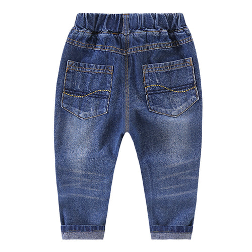 Ripped children's jeans by Ancient Energy showing distressed denim with ripped details and a casual fit.