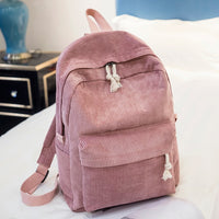 Ancient Energy corduroy backpack for students with shoulder straps, ideal for school and casual use, in a stylish design.