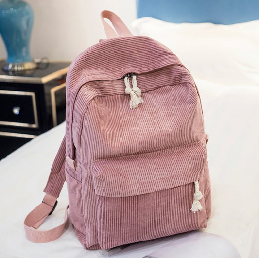Ancient Energy corduroy backpack for students with shoulder straps, ideal for school and casual use, in a stylish design.