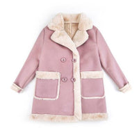 Young child wearing warm winter clothing from Ancient Energy, layered jacket and winter accessories for kids.