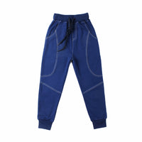 Young boy wearing Ancient Energy boys' sports trousers, athletic pants with a comfortable fit and sporty design.