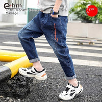 Children's boys' denim trousers by Ancient Energy, showing a pair of casual blue denim pants for kids.