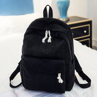 Ancient Energy corduroy backpack for students with shoulder straps and multiple compartments, ideal for school and daily use.