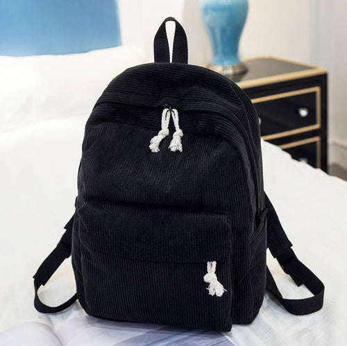 Ancient Energy corduroy backpack for students with shoulder straps and multiple compartments, ideal for school and daily use.