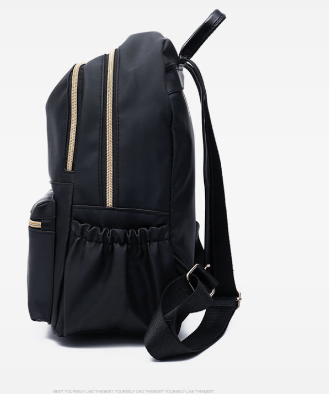 Black waterproof Oxford backpack for women by Ancient Energy, featuring multiple compartments and durable design for school use.