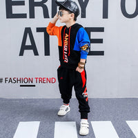Boy wearing a spring Korean children's long-sleeved sports suit by Ancient Energy, featuring a comfortable two-piece outfit for spring.