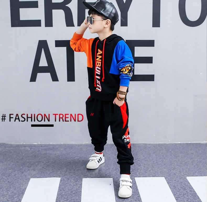 Boy wearing a spring Korean children's long-sleeved sports suit by Ancient Energy, featuring a comfortable two-piece outfit for spring.