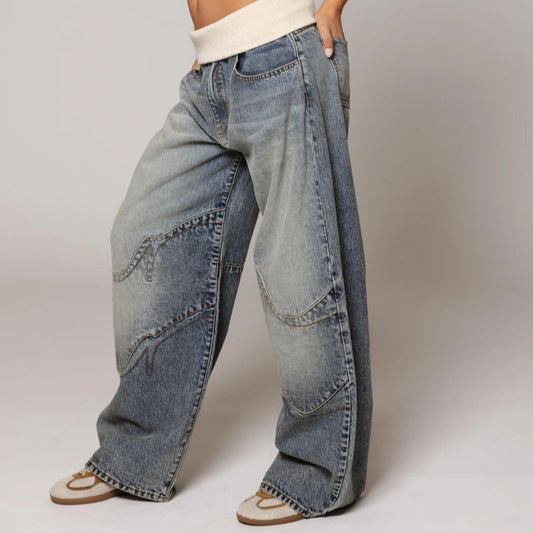Loose-fitting straight-leg jeans with pockets, casual street-style trousers from Ancient Energy, worn with a relaxed fit and classic denim look.