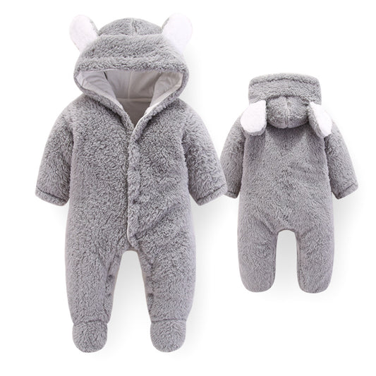 Baby in an Ancient Energy newborn jumpsuit romper, soft and cozy baby outfit, ideal for newborns, on a neutral background.