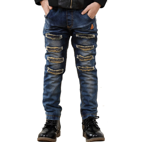 Child boy jeans from Ancient Energy, showing blue denim fabric and classic five-pocket design.