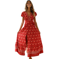 Mandotos International Tropical Bloom Maxi Dress featuring vibrant floral patterns and flowing fabric, perfect for summer occasions.