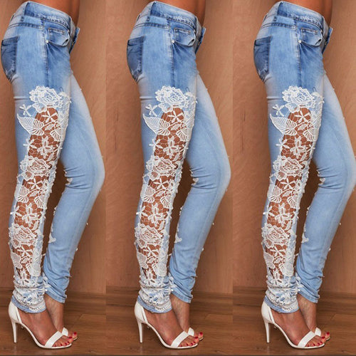 Light blue lace jeans from Ancient Energy with intricate lace detailing and slim fit design.