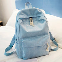 Ancient Energy corduroy backpack with shoulder straps, designed for students, featuring a spacious school bag style in a stylish fabric.