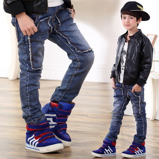 Young boy wearing Ancient Energy jeans, showcasing casual denim pants with a relaxed fit and classic style.