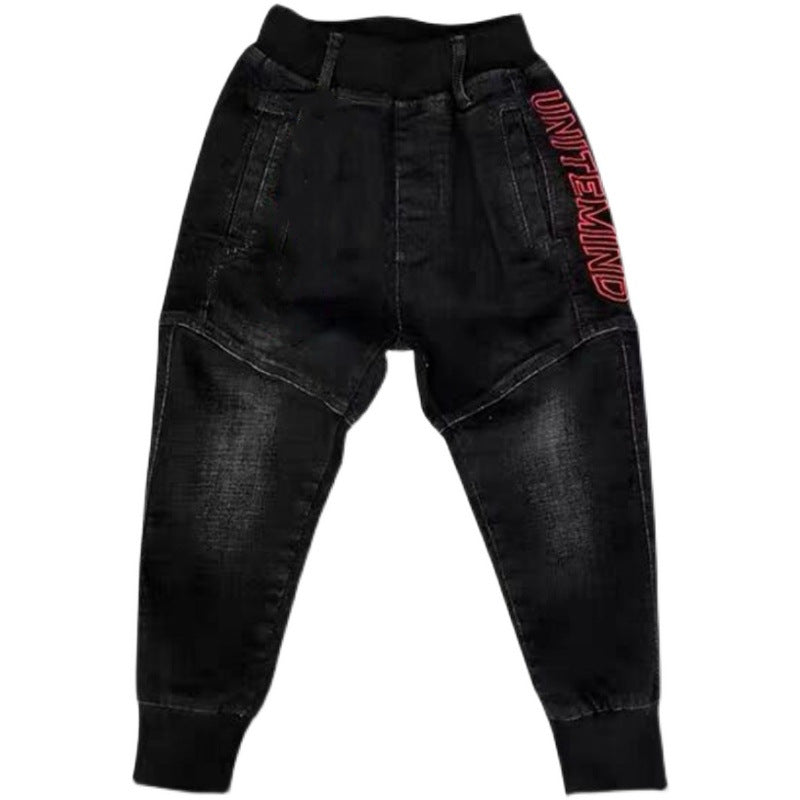 Kids black jeans from Ancient Energy featuring single-leg style, suitable for spring and autumn boys' casual wear.