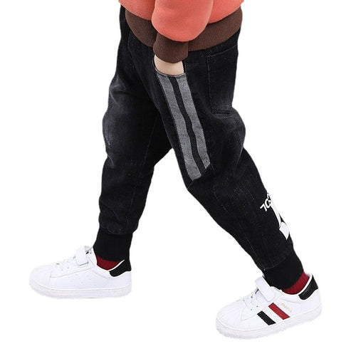 Children's boys' denim trousers from Ancient Energy featuring classic blue denim fabric and a relaxed fit.