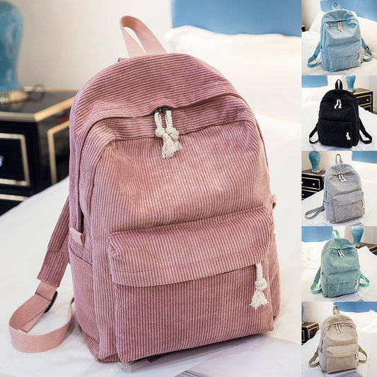Ancient Energy corduroy backpack for students with shoulder straps, stylish school bag with multiple compartments.