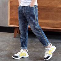 Children's boys' denim trousers by Ancient Energy, featuring classic blue denim with pockets and adjustable waistband.