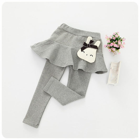 Children's cotton leggings and lace skirt pants set by Ancient Energy, featuring pink and white fabric with playful design details.