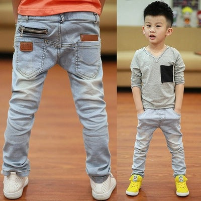 Young boy wearing Ancient Energy boys' spring and autumn pants, casual style, comfortable fit, outdoor setting