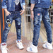 Boy wearing Ancient Energy velvet one-piece jeans for autumn and winter, featuring a cozy, stylish denim design.