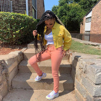 Women’s denim jacket by Ancient Energy featuring a casual, cropped streetwear style with fitted bodycon design and outwear features.