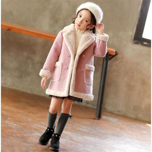 Winter children's clothing from Ancient Energy, featuring a cozy jacket and accessories for cold weather.