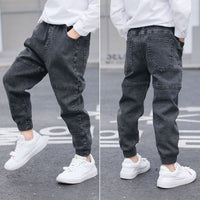 Ancient Energy boys' spring and autumn jeans, casual denim pants for kids, shown in a natural pose.
