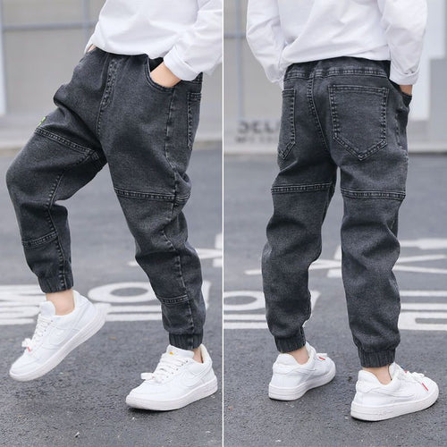 Ancient Energy boys' spring and autumn jeans, casual denim pants for kids, shown in a natural pose.