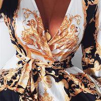 Mandotos International chic vintage floral evening dress with V-neck, featuring elegant fabric and intricate floral pattern.