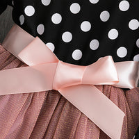 Polka dot princess dress for young girls by Ancient Energy, featuring a charming design with ruffles and a satin bow.