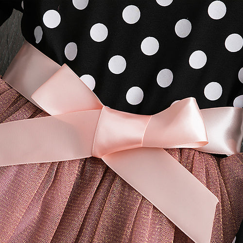 Polka dot princess dress for young girls by Ancient Energy, featuring a charming design with ruffles and a satin bow.