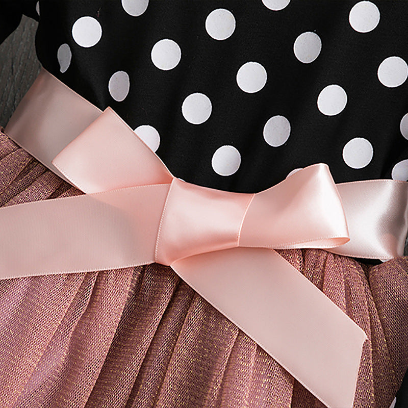 Polka dot princess dress for young girls by Ancient Energy, featuring a charming design with ruffles and a satin bow.