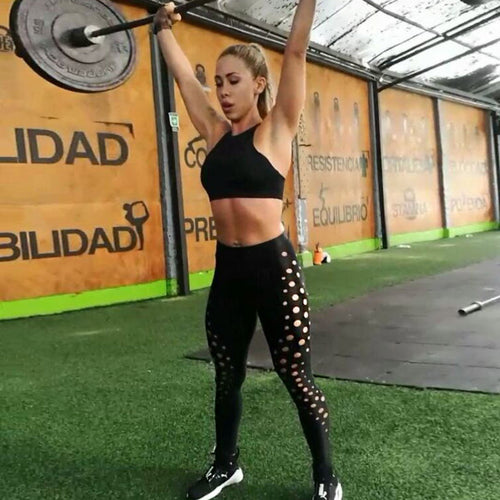 Black women's ankle-length cotton leggings with round hole design, quick-dry fabric, push-up fit, ideal for workout and slimming.