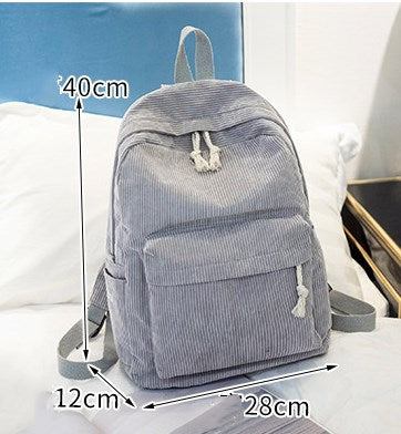 Ancient Energy corduroy backpack for students with shoulder straps, suitable for school and casual use.